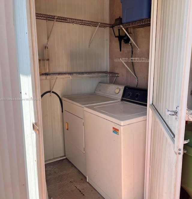 clothes washing area with washer and dryer and laundry area