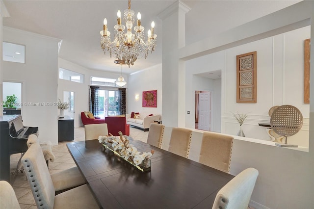 dining room with light tile patterned floors and ornamental molding