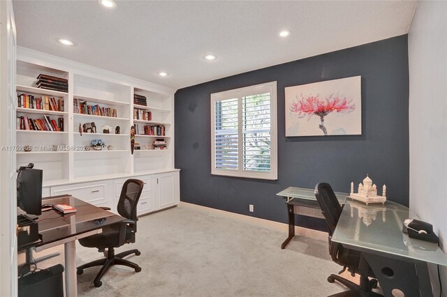 office space with recessed lighting, baseboards, and light carpet