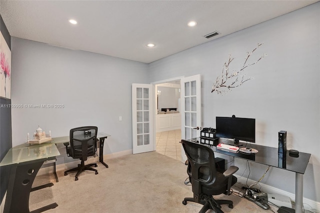 carpeted office space featuring visible vents, recessed lighting, french doors, and baseboards