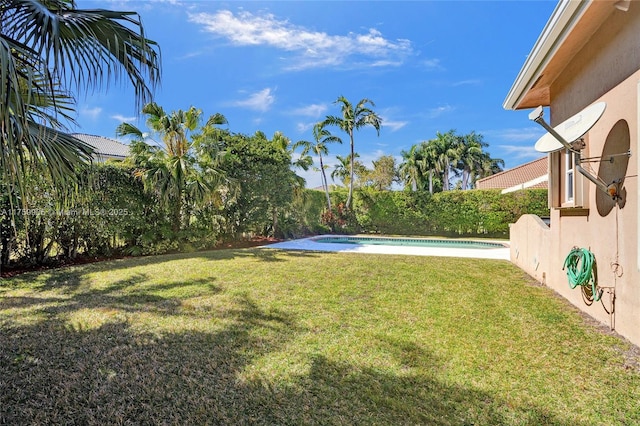 view of yard featuring a fenced in pool