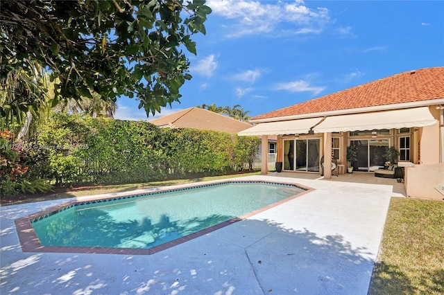 view of pool with a fenced in pool and a patio area