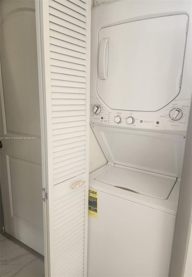 washroom with laundry area and stacked washer / dryer