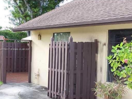 view of gate with fence