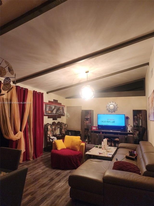 living area with beamed ceiling and wood finished floors