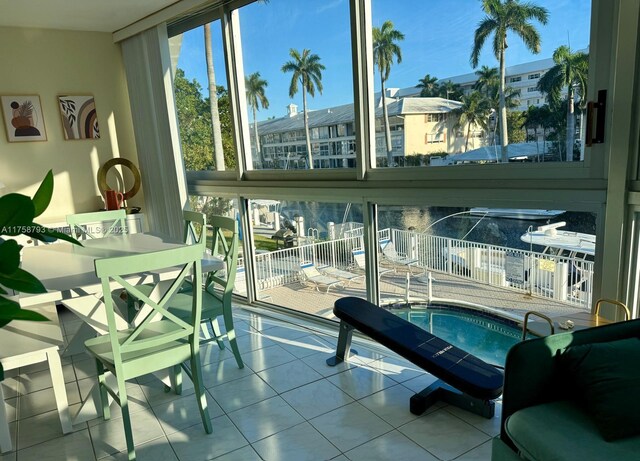 sunroom / solarium with a hot tub