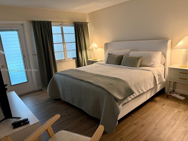 bedroom with wood finished floors