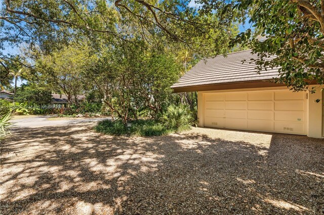 5780 Magnolia Ln, Coral Gables, FL 33156 - garage featuring gravel driveway