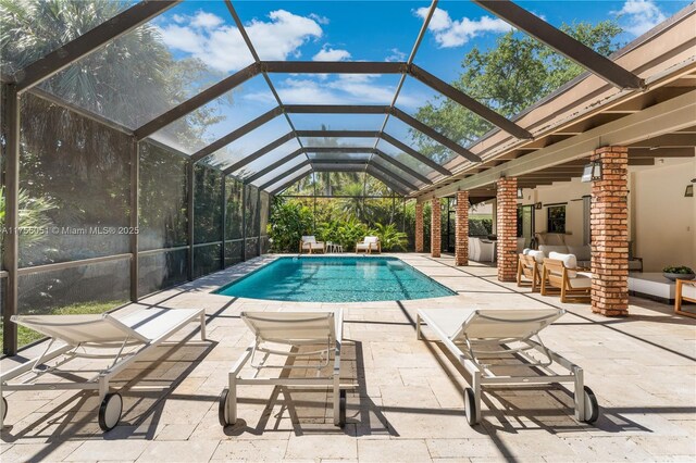 5780 Magnolia Ln, Coral Gables, FL 33156 - swimming pool with outdoor lounge area, a patio, and a lanai