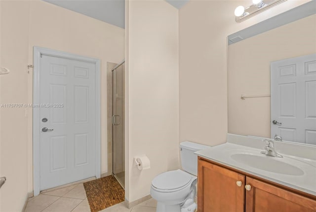 full bathroom with vanity, tile patterned floors, toilet, and a shower stall