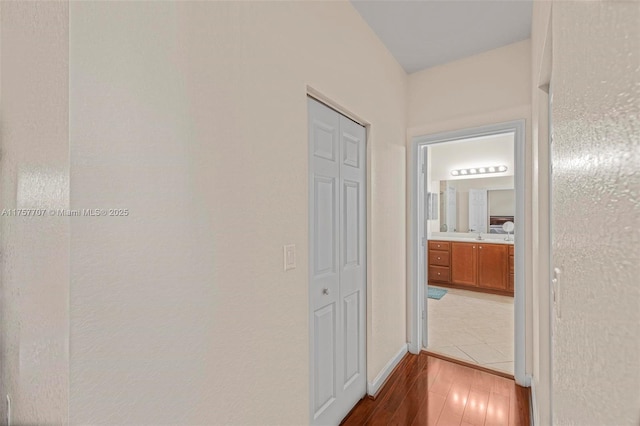 hall with wood finished floors