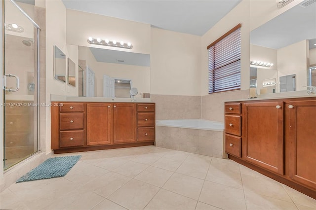 full bathroom with two vanities, a sink, tile patterned flooring, a shower stall, and a bath
