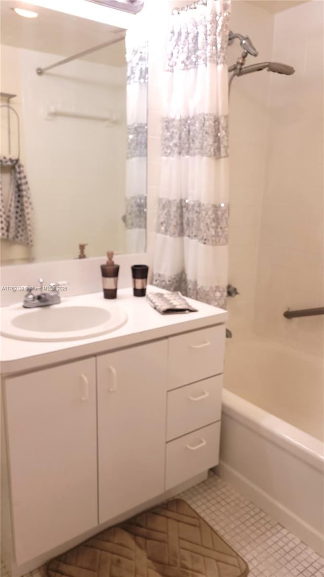 full bath featuring vanity, shower / bathtub combination with curtain, and tile patterned flooring