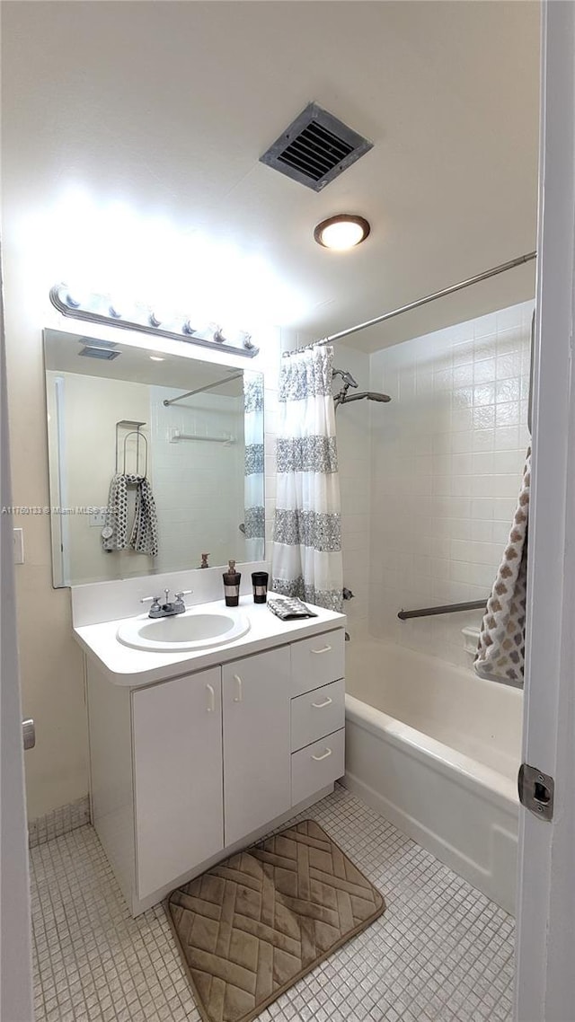 bathroom featuring visible vents, shower / tub combo with curtain, vanity, and tile patterned flooring