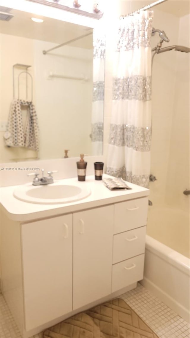 bathroom with tile patterned flooring, visible vents, vanity, and shower / tub combo with curtain