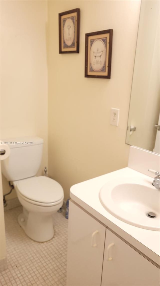 half bath with toilet and vanity