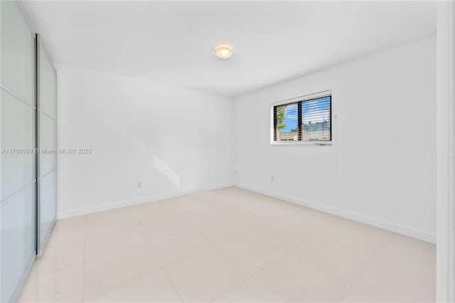 unfurnished bedroom featuring baseboards