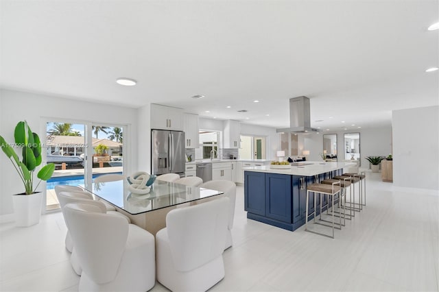 dining room with recessed lighting and baseboards