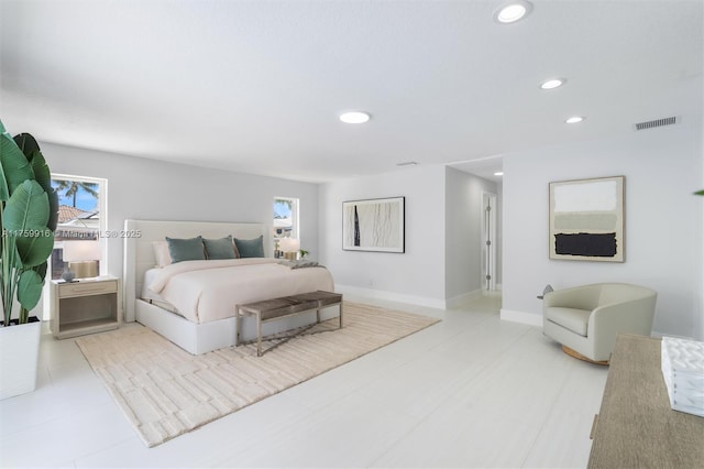 bedroom featuring recessed lighting, visible vents, multiple windows, and baseboards