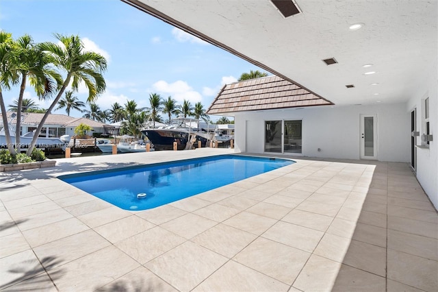 pool featuring a patio area