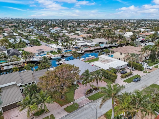 bird's eye view featuring a residential view and a water view