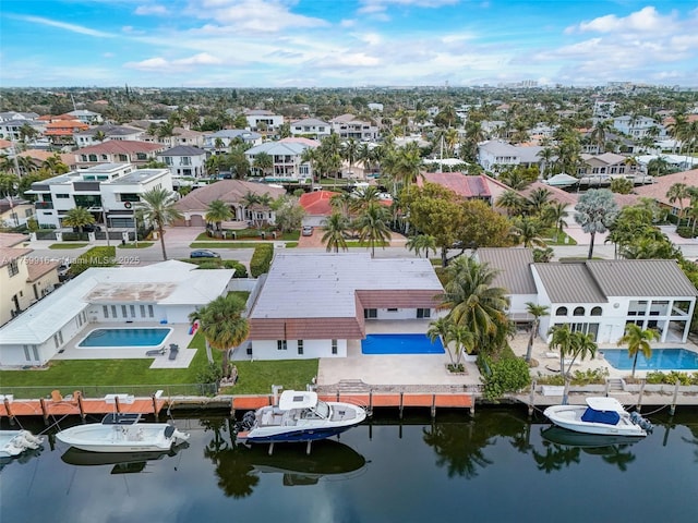 bird's eye view featuring a residential view and a water view