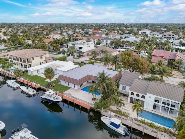 birds eye view of property featuring a residential view and a water view