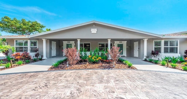 ranch-style home with stucco siding