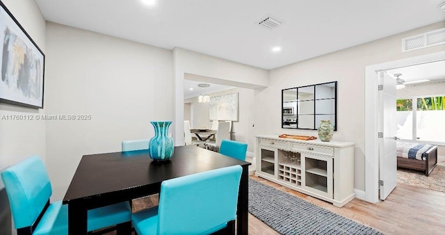 dining area featuring recessed lighting, a ceiling fan, visible vents, and light wood-type flooring