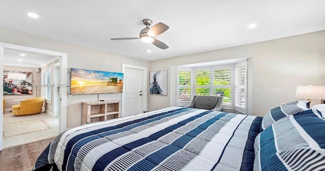 bedroom with recessed lighting, wood finished floors, and ceiling fan