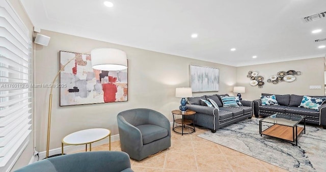 living area with light tile patterned floors, visible vents, baseboards, and recessed lighting