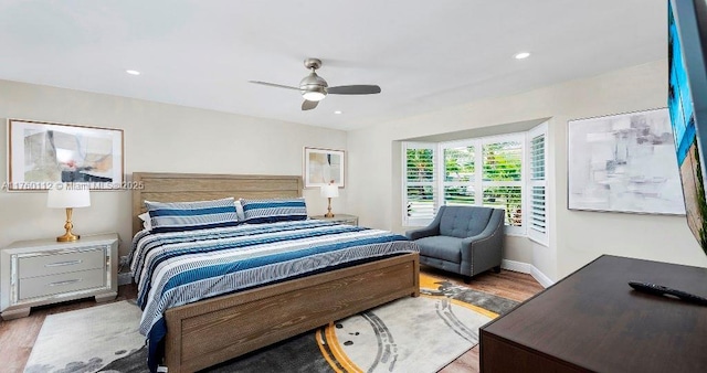 bedroom featuring recessed lighting, baseboards, ceiling fan, and wood finished floors