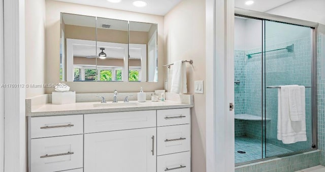 full bath featuring visible vents, a stall shower, and vanity