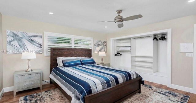 bedroom featuring recessed lighting, wood finished floors, baseboards, and ceiling fan