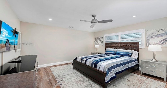 bedroom with wood finished floors, visible vents, baseboards, recessed lighting, and ceiling fan