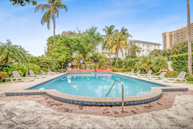 community pool with a patio area