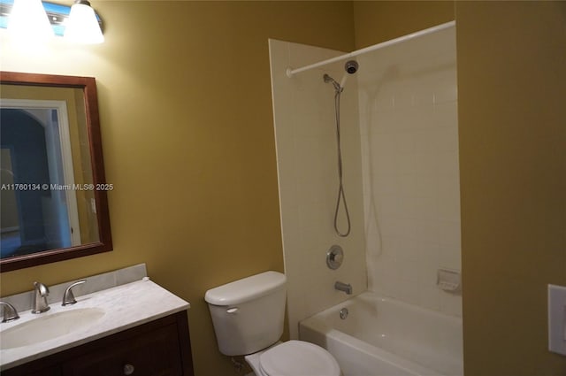 bathroom with bathing tub / shower combination, toilet, and vanity