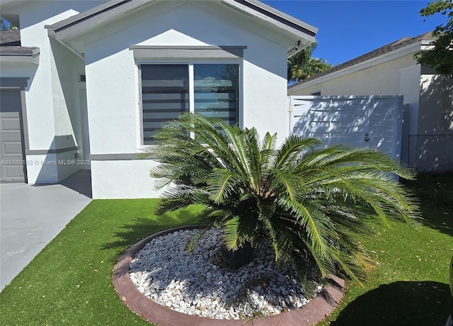 view of side of property with stucco siding