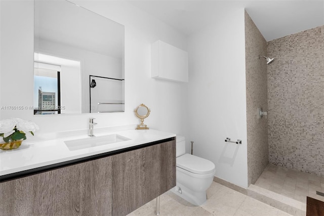 68 SE 6th St Unit 1404, Miami, FL 33131 - bathroom with a tile shower, tile patterned flooring, toilet, and vanity