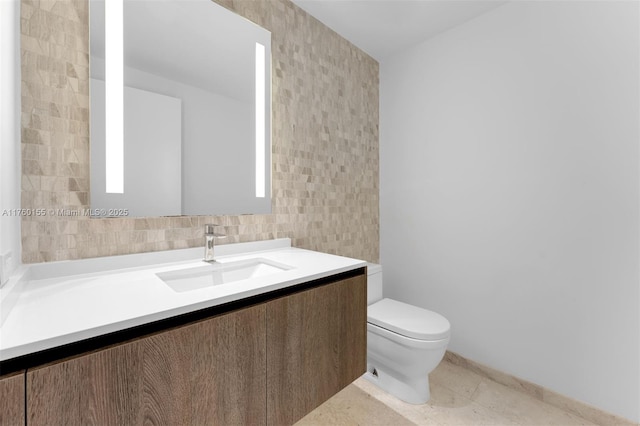 68 SE 6th St Unit 1404, Miami, FL 33131 - half bath with vanity, tile walls, toilet, and tile patterned flooring