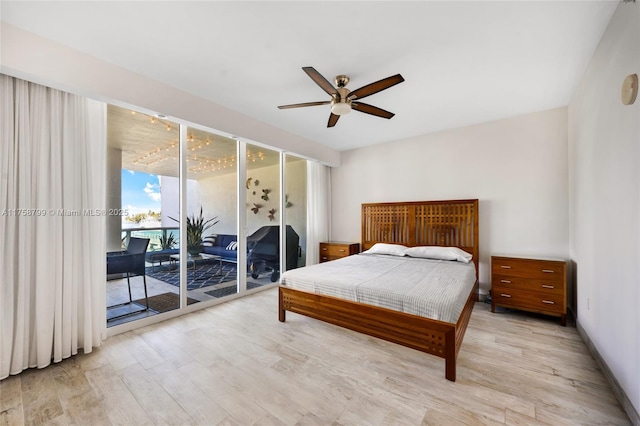 bedroom with baseboards, light wood-style floors, ceiling fan, and access to outside