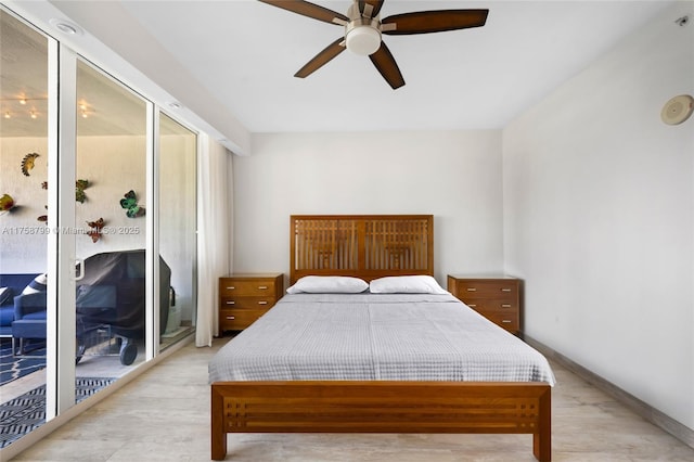 bedroom featuring a ceiling fan and baseboards