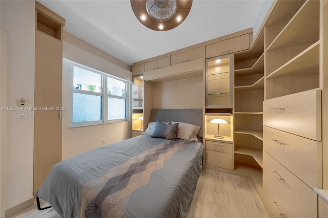 bedroom with light wood-type flooring