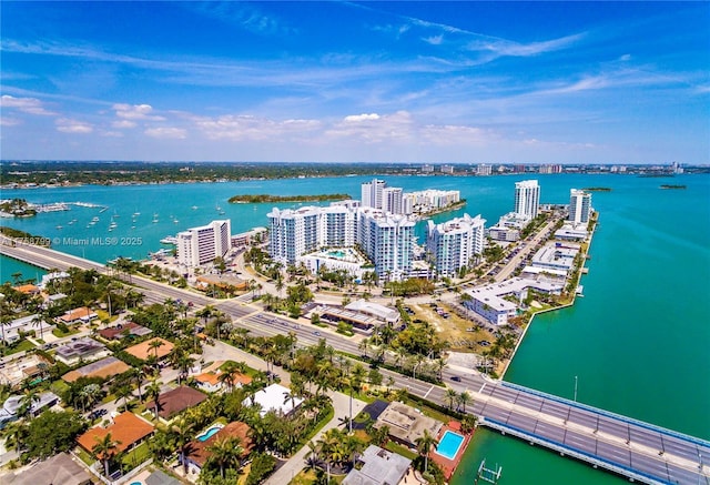 drone / aerial view with a view of city and a water view