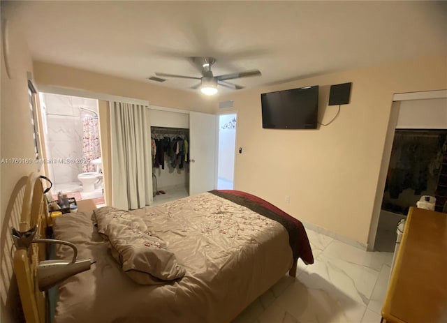 bedroom featuring visible vents, a ceiling fan, marble finish floor, and a closet