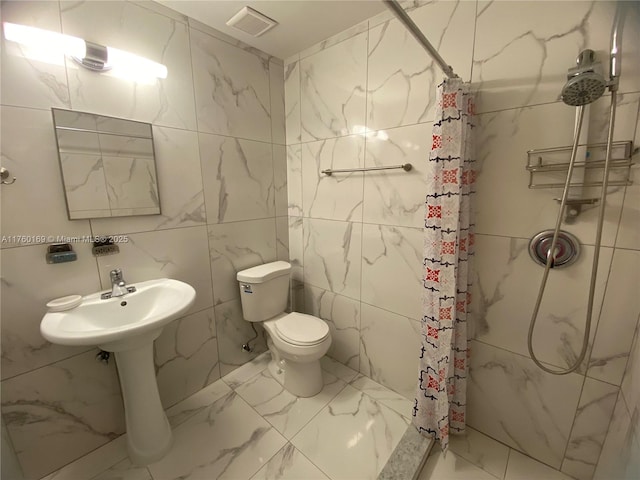 bathroom with a shower stall, toilet, visible vents, and marble finish floor