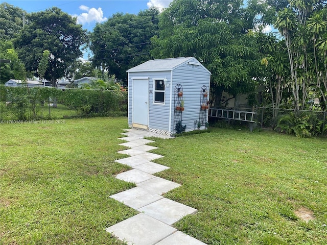 view of yard with a fenced backyard, a storage shed, and an outdoor structure