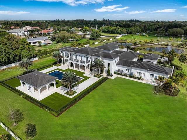 birds eye view of property with a residential view and a water view