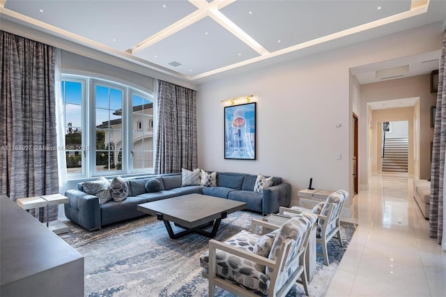 living room featuring stairway, visible vents, and coffered ceiling