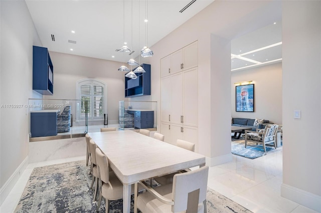 dining room with recessed lighting, a fireplace, marble finish floor, and baseboards